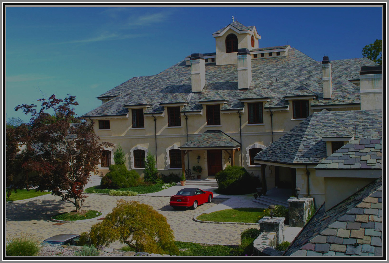 Elegant entrance courtyard with paver by Artistic Outdoors