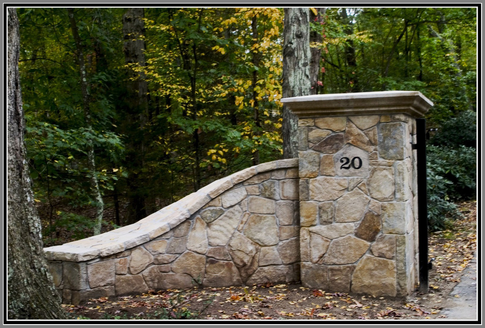 Driveway columns, lights and walls by Artistic Outdoors