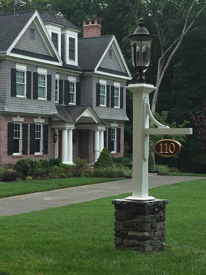 Driveway light with stone foot column by Artistic Outdoors