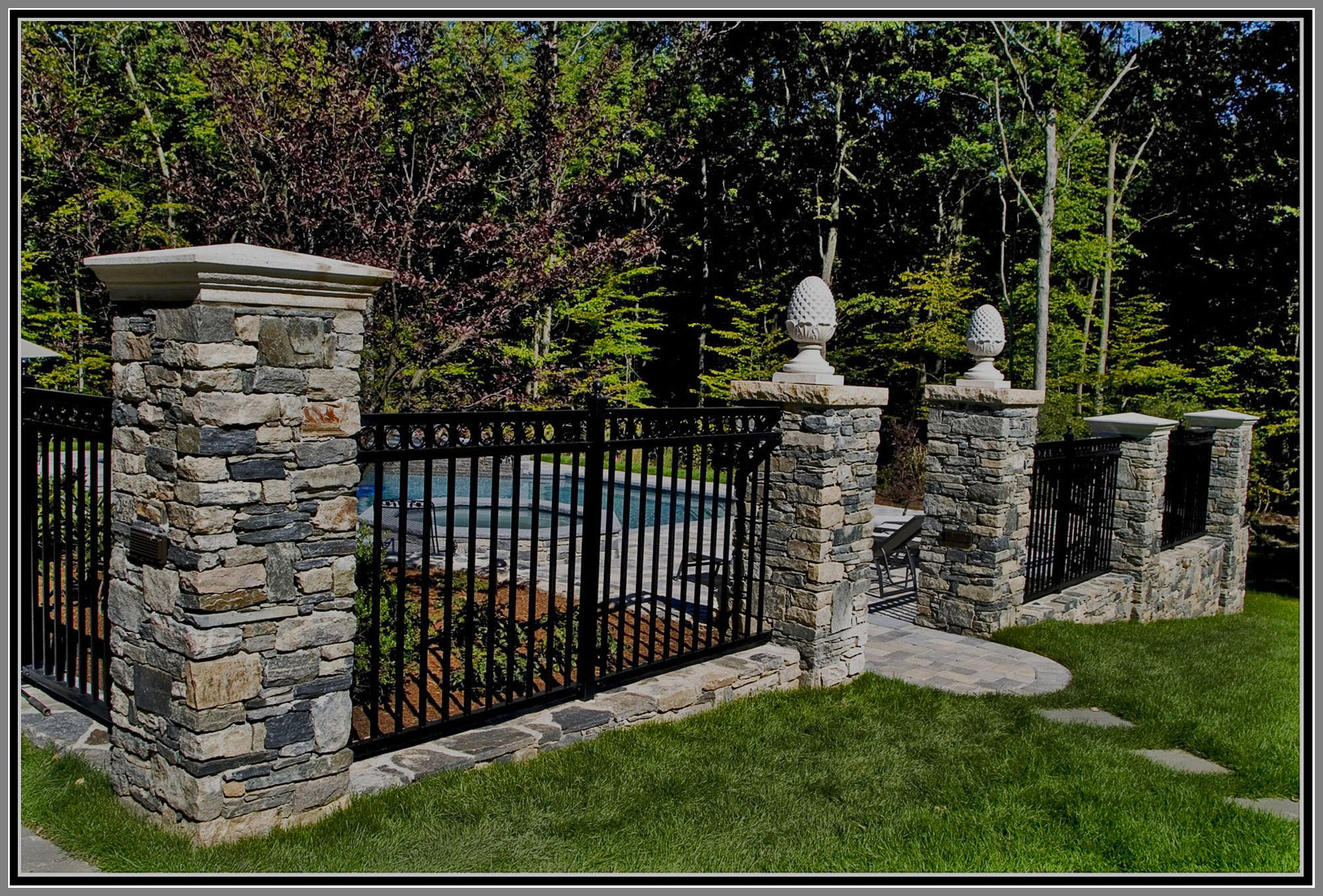 Aluminium Fence with stone columns by Artistic Outdoors