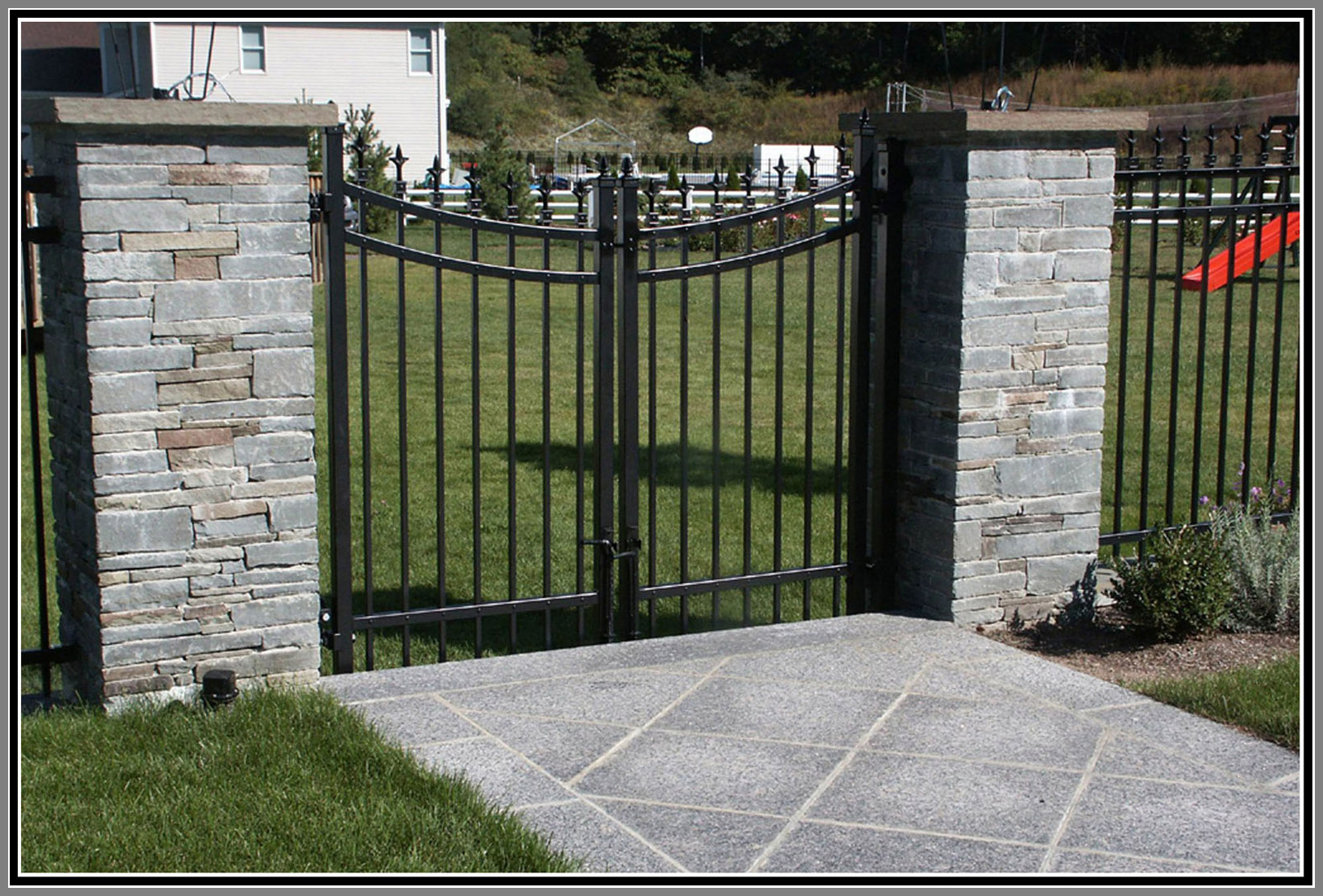 Aluminium fence and gate with stone columns