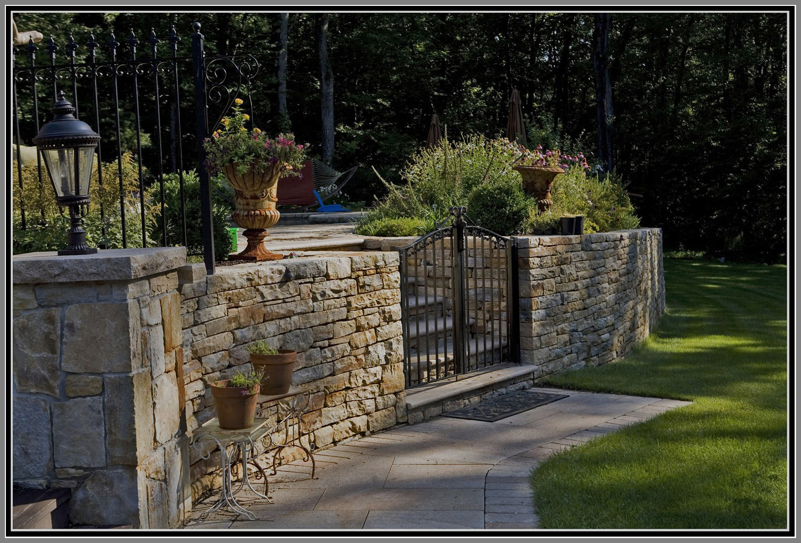 Stone wall pool fence with gate