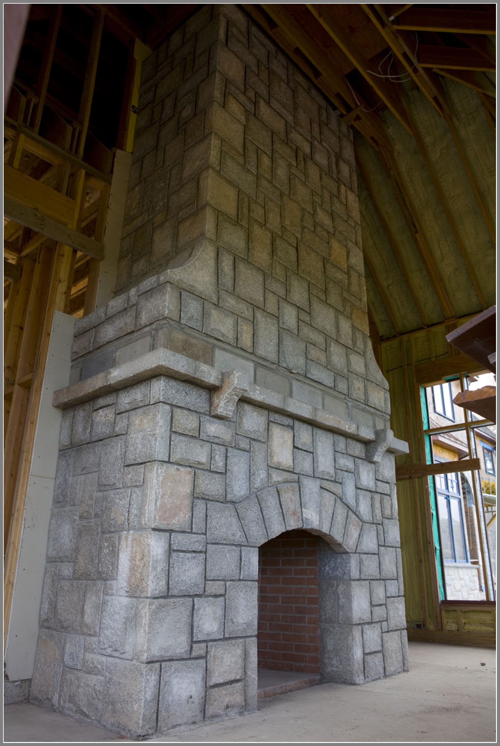 Granite stone fireplace by Artistic Outdoors