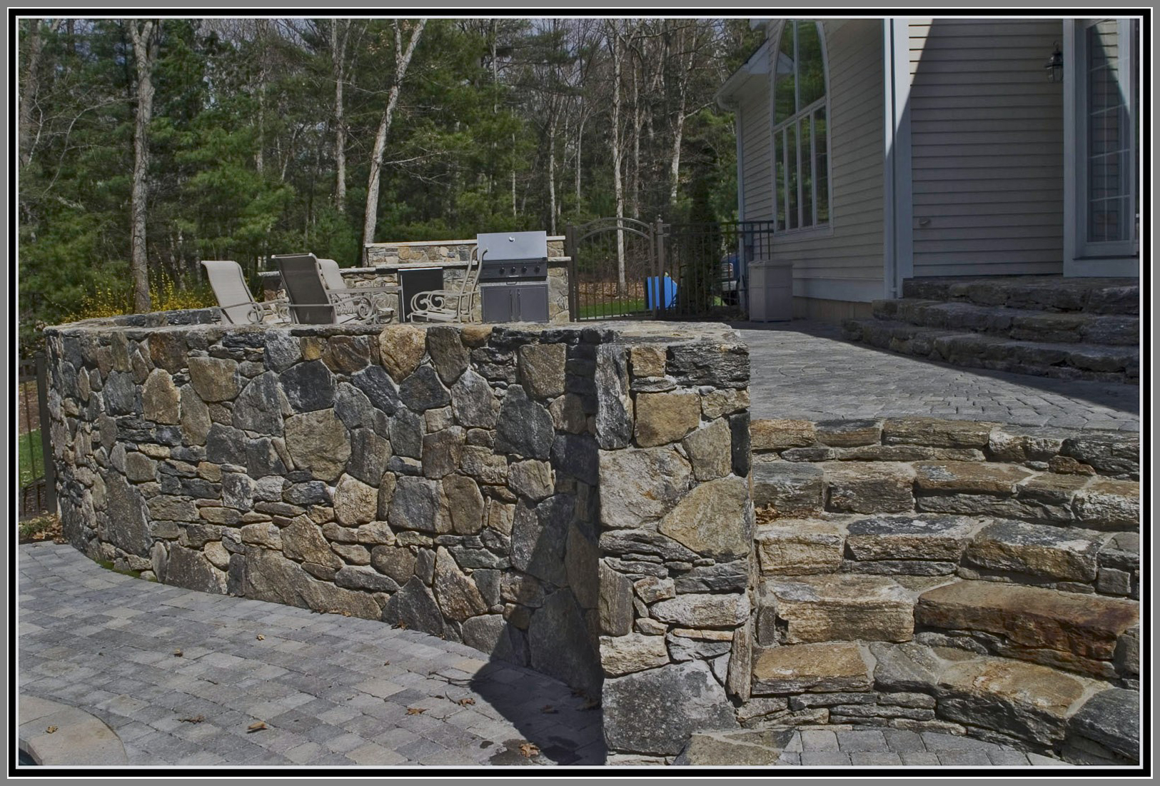 Field stone wall and steps by Artistic Outdoors