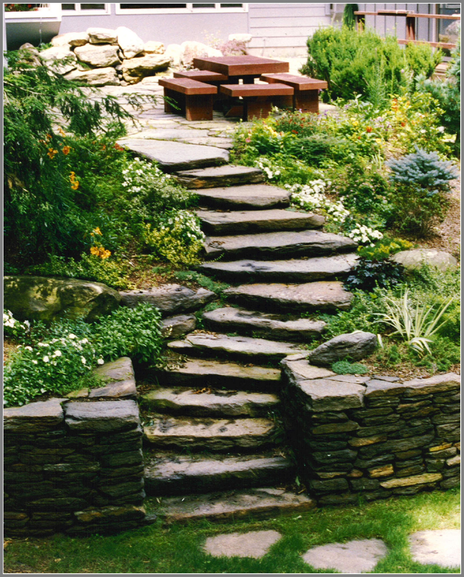 Rustic Stone wall and steps by Artistic Outdoors