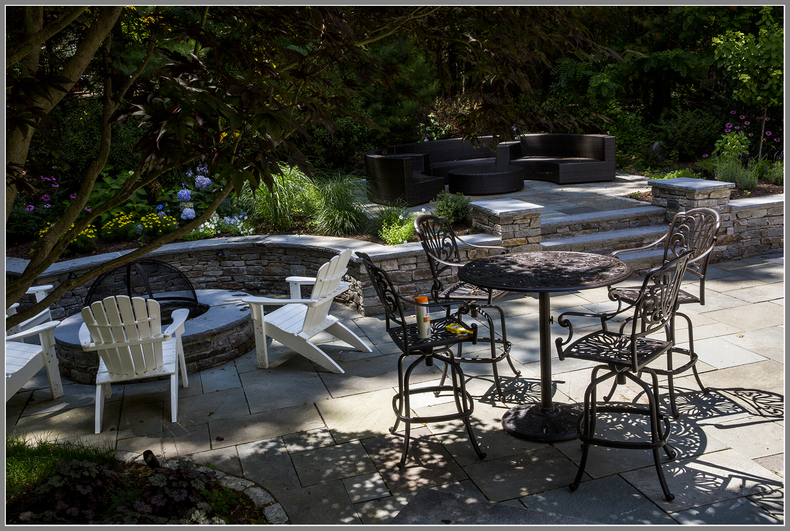 Fire pit and outdoor room by Artistic Outdoors