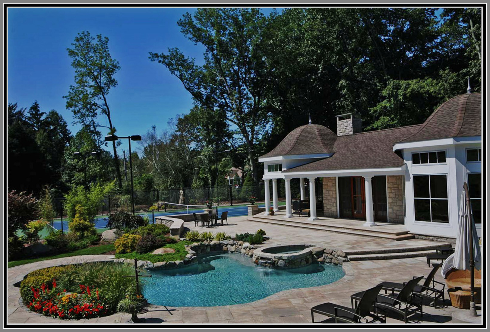 Swimming pool, granite deck and pool house.