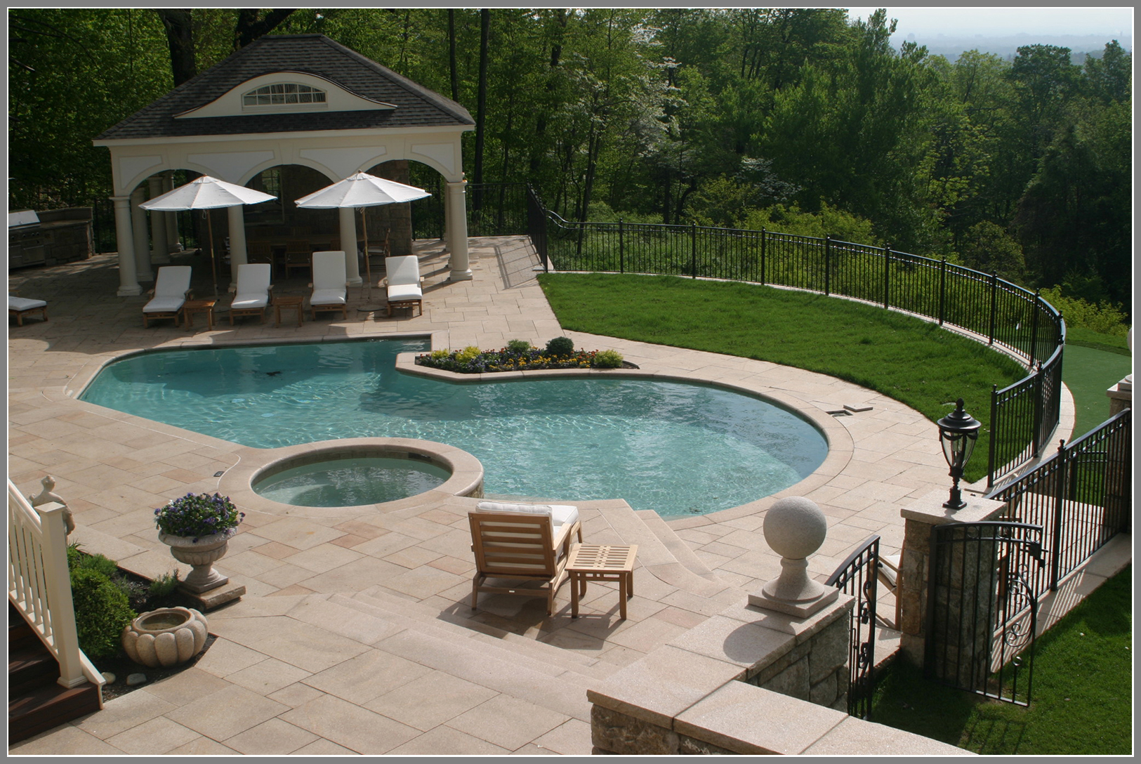 Swimming pool design and masonry by Artistic Outdoors