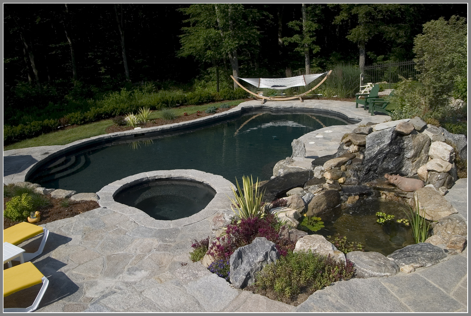 Pool design with fish pond and waterfalls an