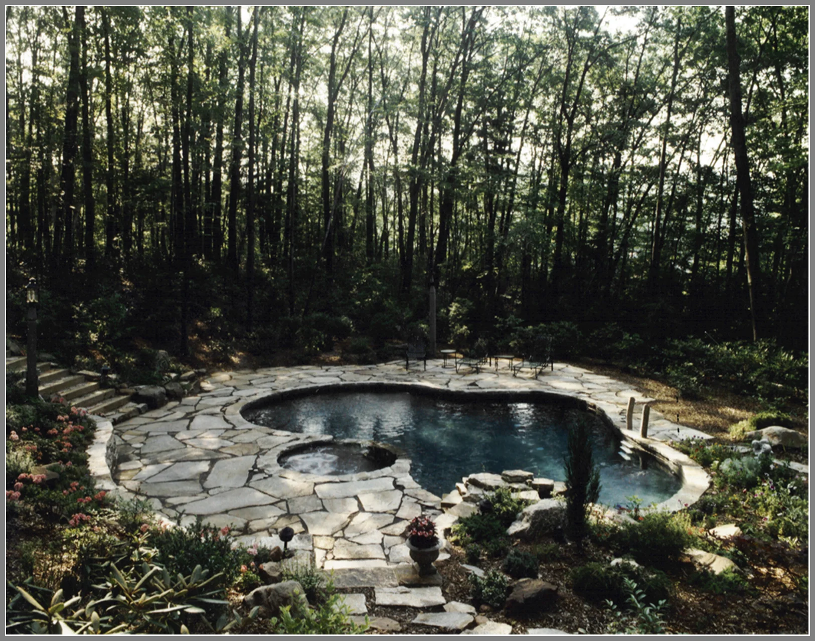 Granite pool patio by Artistic Outdoors