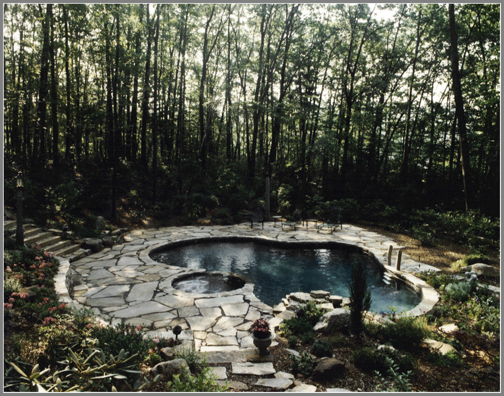 Granite pool patio by Artistic Outdoors