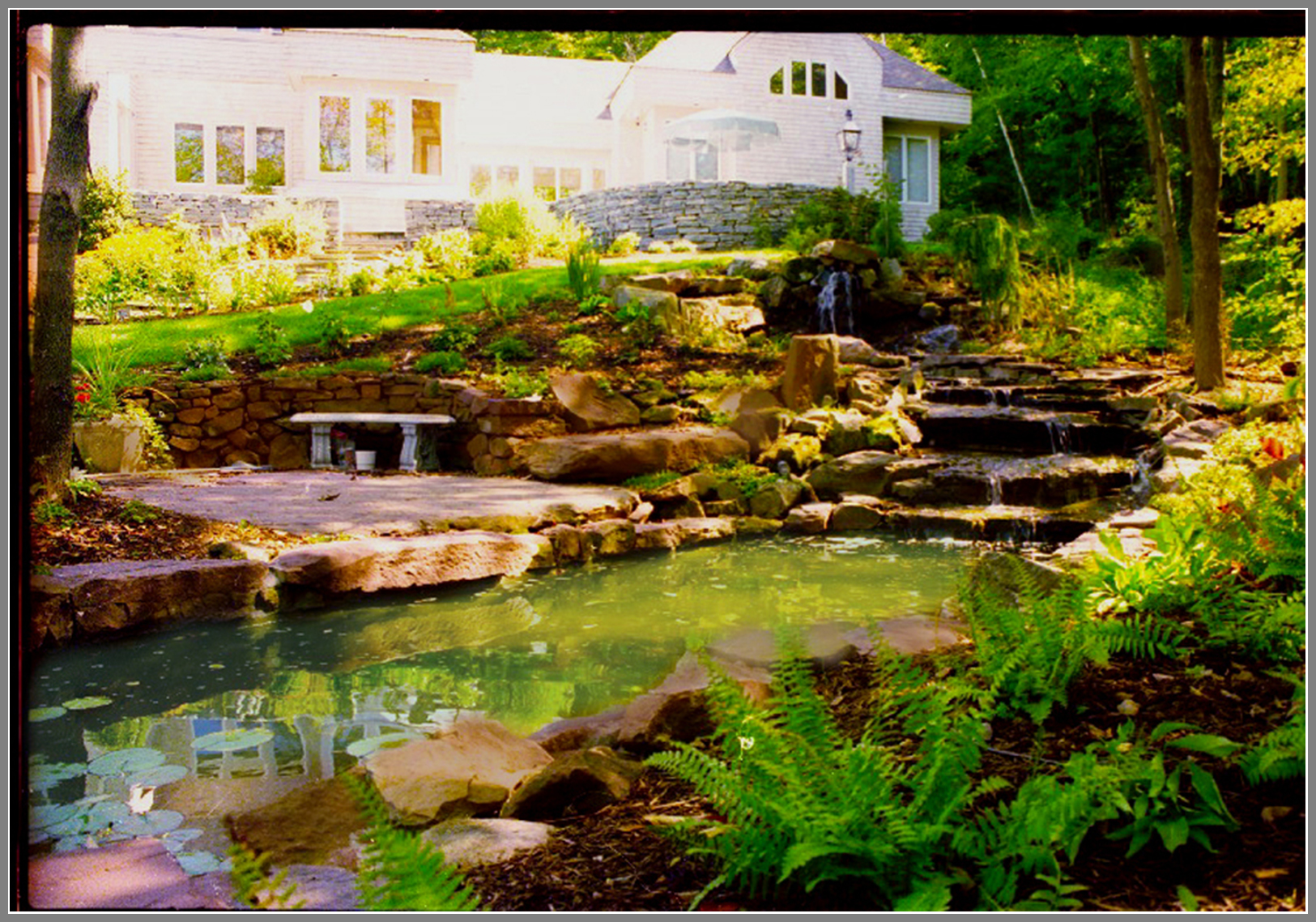Waterfalls and pond by Artistic Outdoors