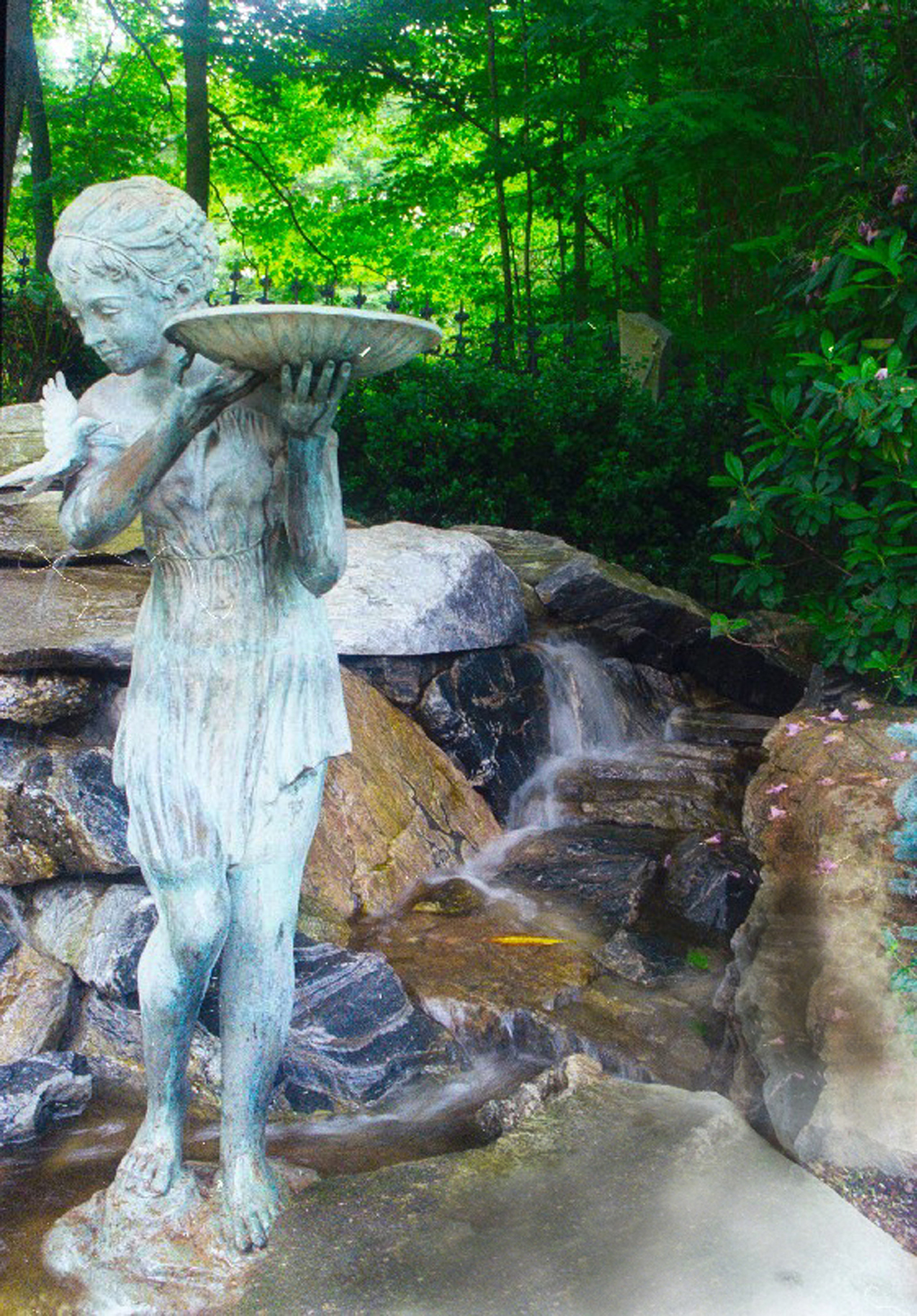 Bronze statue in water garden