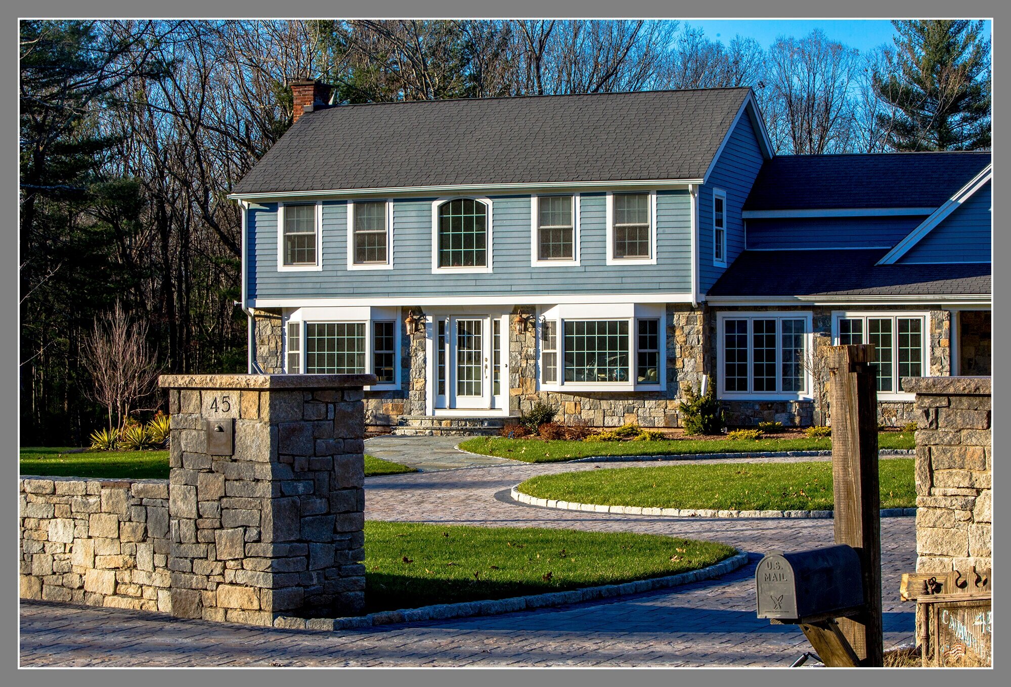  Stone column with built-in mailbox and paver driveway  