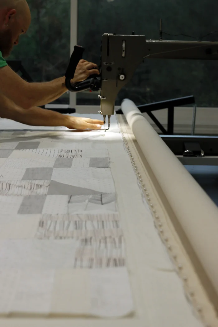 Brandon basting long quilt.jpg