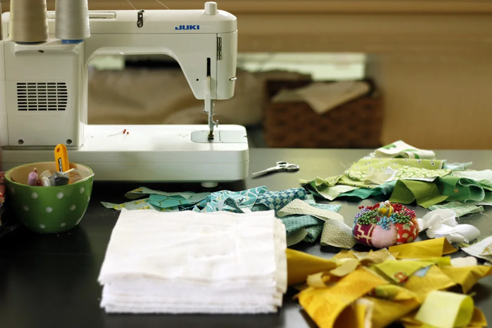 stacks on the sewing table.jpg