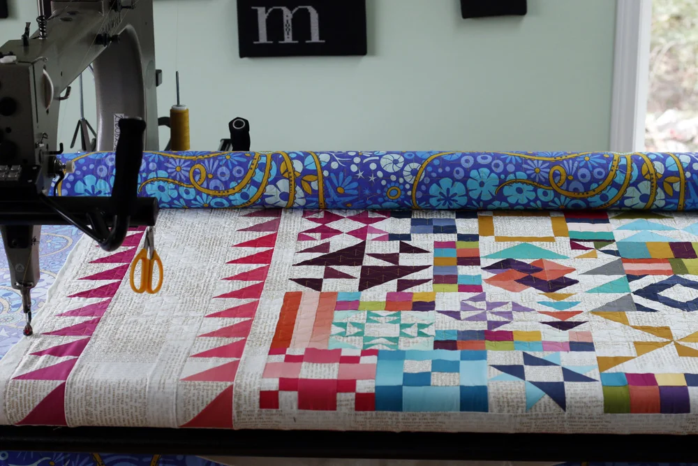 Naomi Grebe on longarm. Stitched in Color.jpg