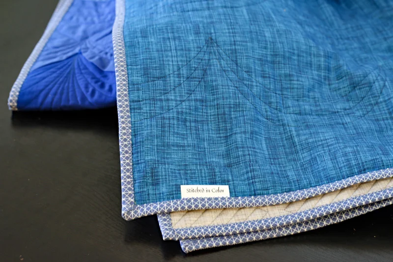 Color Weave quitl back. Stitched in Color.jpg