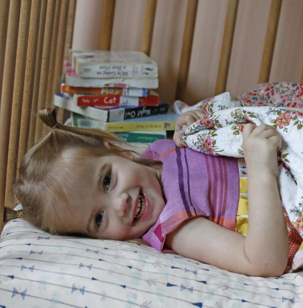 Elora in bed. Stitched in Color.jpg