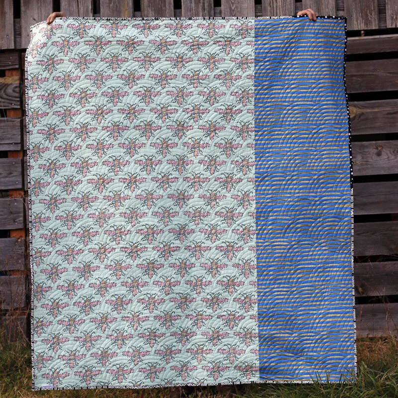 https://images.squarespace-cdn.com/content/v1/58aa4fc51e5b6ce697e5bf40/1591964793949-ZL1P7XV15Y33FX2A7I4A/funky%2Bquilt%2Bback.%2BStitched%2Bin%2BColor.jpg