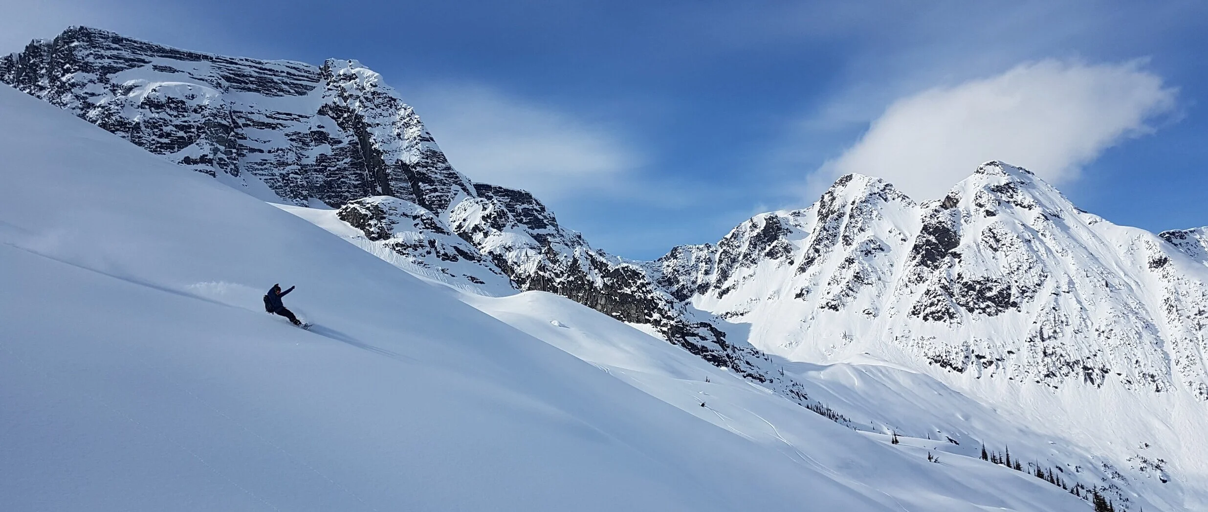 BRMP Mentor Lukas Matejovsky catching a white wave in Rogers Pass (PC: D.McLachlan)