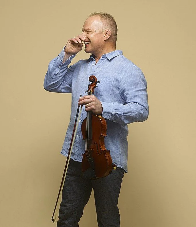 A photo of violinist & director John Noble