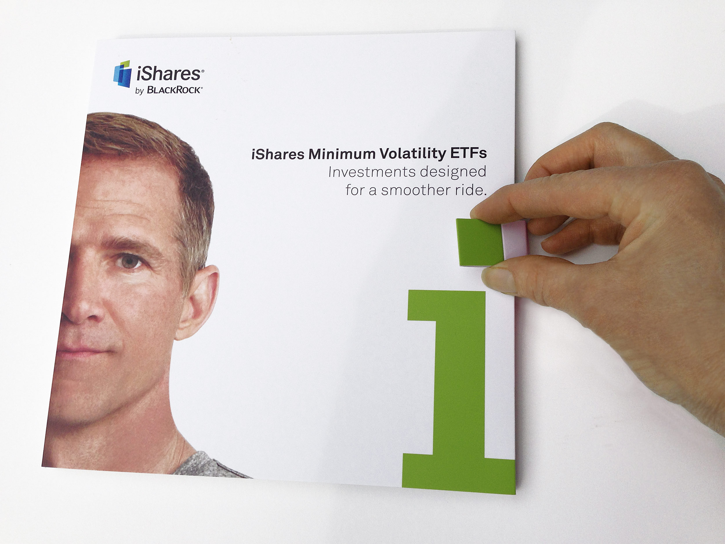 The magnetic clip forming the top of the "i" unlocks the package.