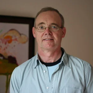 Bernie with figurative painting behind.