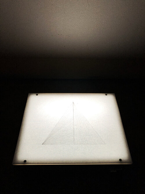  Pyramid floating on the horizon line of humanity. Graphite on bond paper placed on light box, drawing 9 ¾ x 12 ¼ overall 9 ¾ x 12 ¼ x 3 ¼” , 2019. 