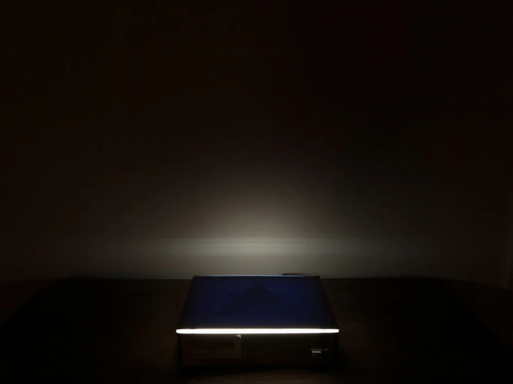 Floating on the Horizon Line of Humanity Exist Numbers Equating to 1. Twenty two drawings, graphite on bond paper placed on light box, drawings 9 ¾ x 12 ¼ overall variable 9 ¾ x 12 ¼ x 3 ¼”, 2019.