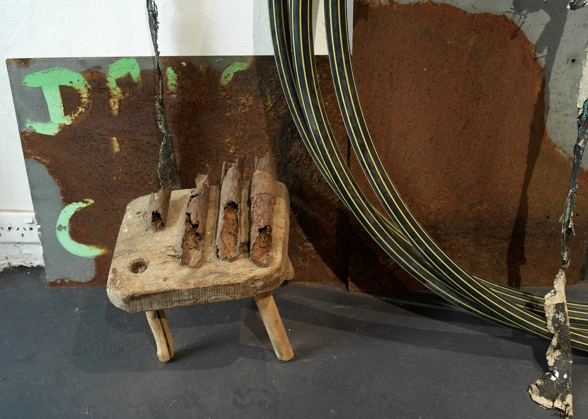 Precious Things (detail), 2018 Metal braces, metal scoreboard numbers, length of hessian, hessian bags (various), fly wire screens, mooring rope, aged tarpaulin, metal rod with synthetic rope attached, wooden trellis, pieces of wood, awning, shovel head, copper piping, rubber gloves, windmill blades, roll of used ram board, cardboard pieces, metal frames (oven), plastic gas piping, plastic hazard stand, plastic polythene sheets, plywood, electronic component (oven), wooden stool, rusted pieces of piping, tree bark, seed pods, metal signs, telegraph insulators, local rocks, lapis lazuli, plastic (clear and opaque), studio leftovers/experiments, paint, bitumen rubber, tape, nails. 300 x 300 x 280 cm Photograph Grant Hancock