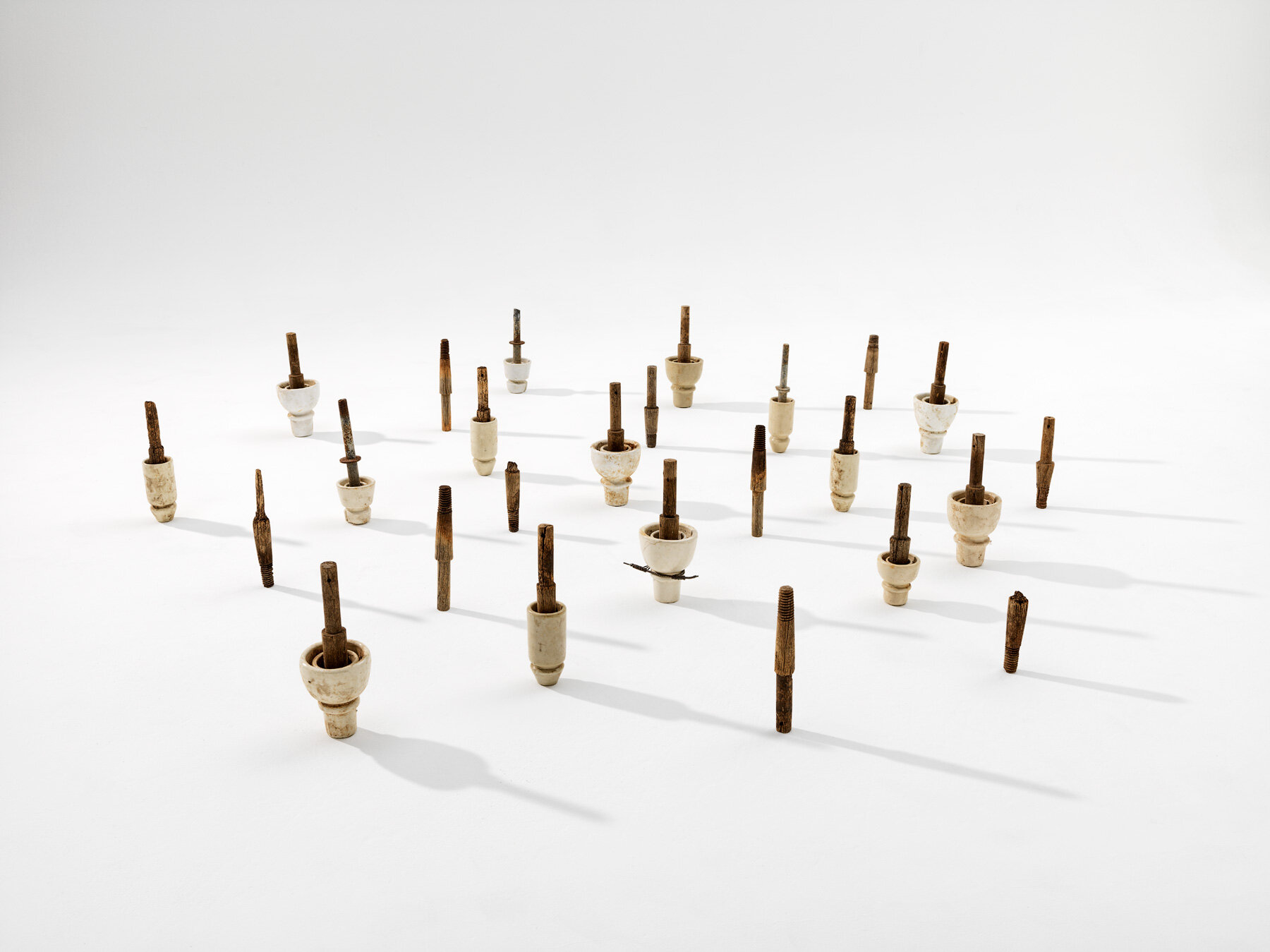   Bonded,  2019  found telegraph insulators  approx 30 x 160 x 160 cm  Photograph Grant Hancock 