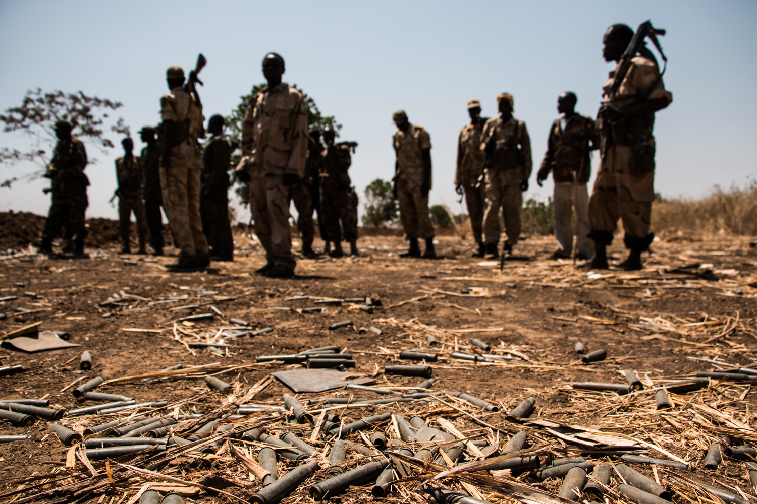 Empty bullet casings litter the ground after a recent battle in Angartu, South Kordofan, Sudan. The rebel SPLA-North claimed to have pushed out the Sudanese Armed Forces. Territory regularly goes back and forth between the fighting factions.