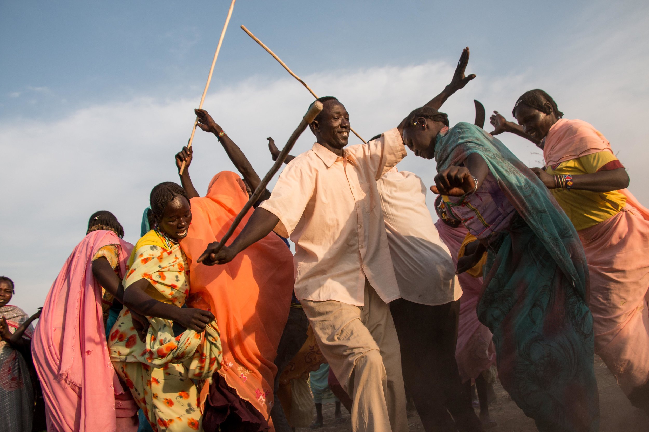 Nuba refugees shelter on the banks of the river in Upper Nile state, South Sudan. Here they are celebrating the marriage of relatives who are still back home in South Kordofan.