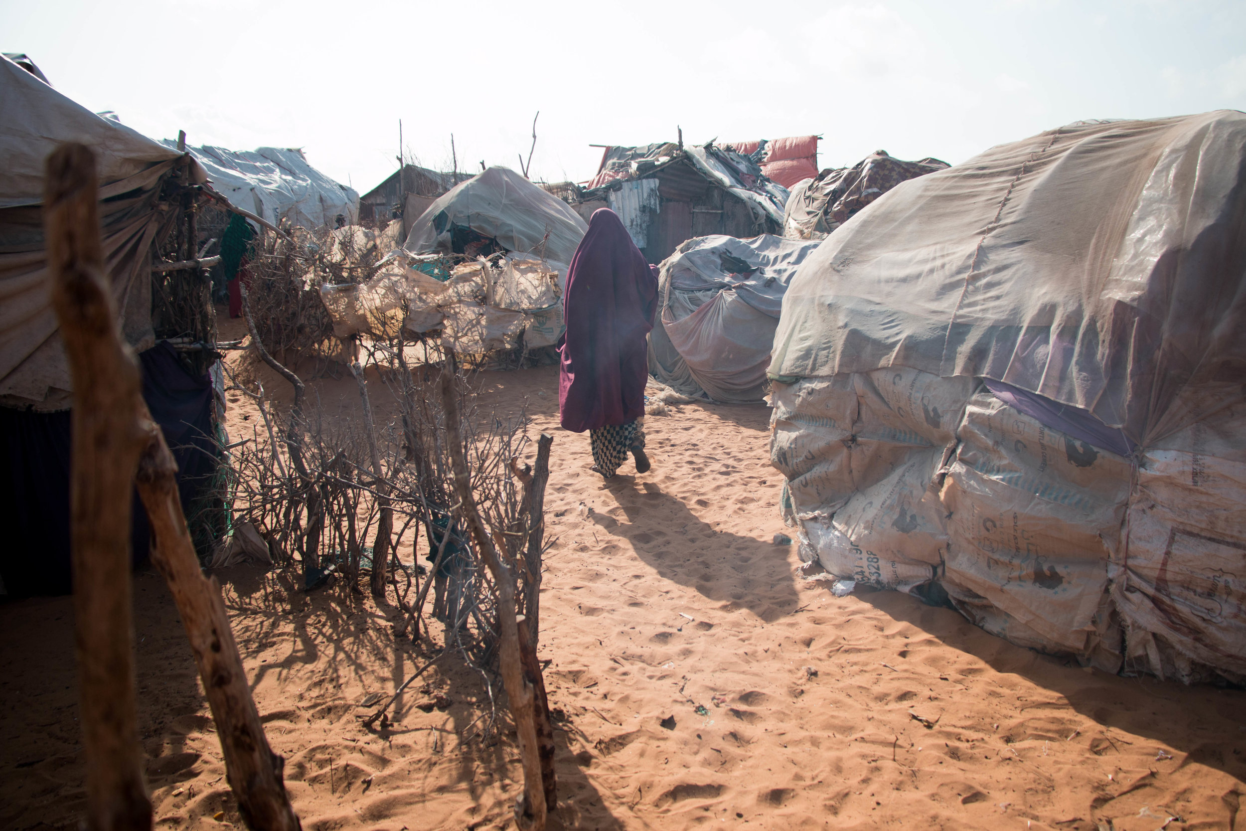Spontaneous displacement camp for refugees returning from Kenya to southern Somalia's Kismayo area as part of a 'voluntary' repatriation scheme.