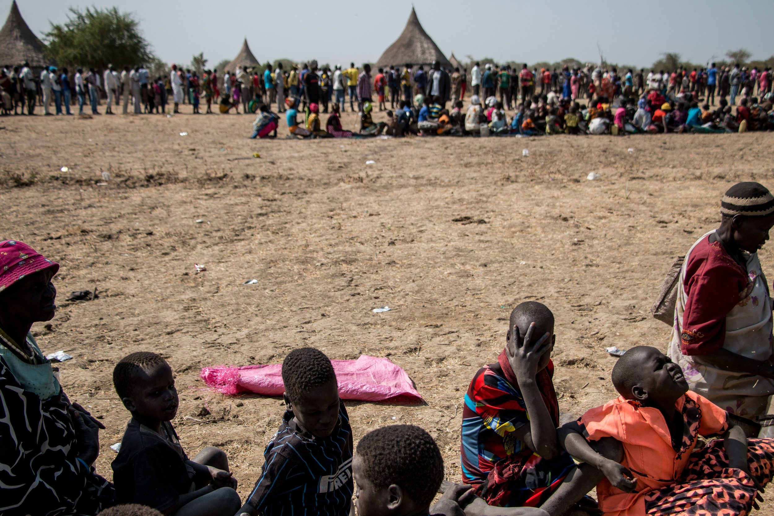 Civilians queue in the scorching sun for a massive aid distribution in Nyal, Unity state. 