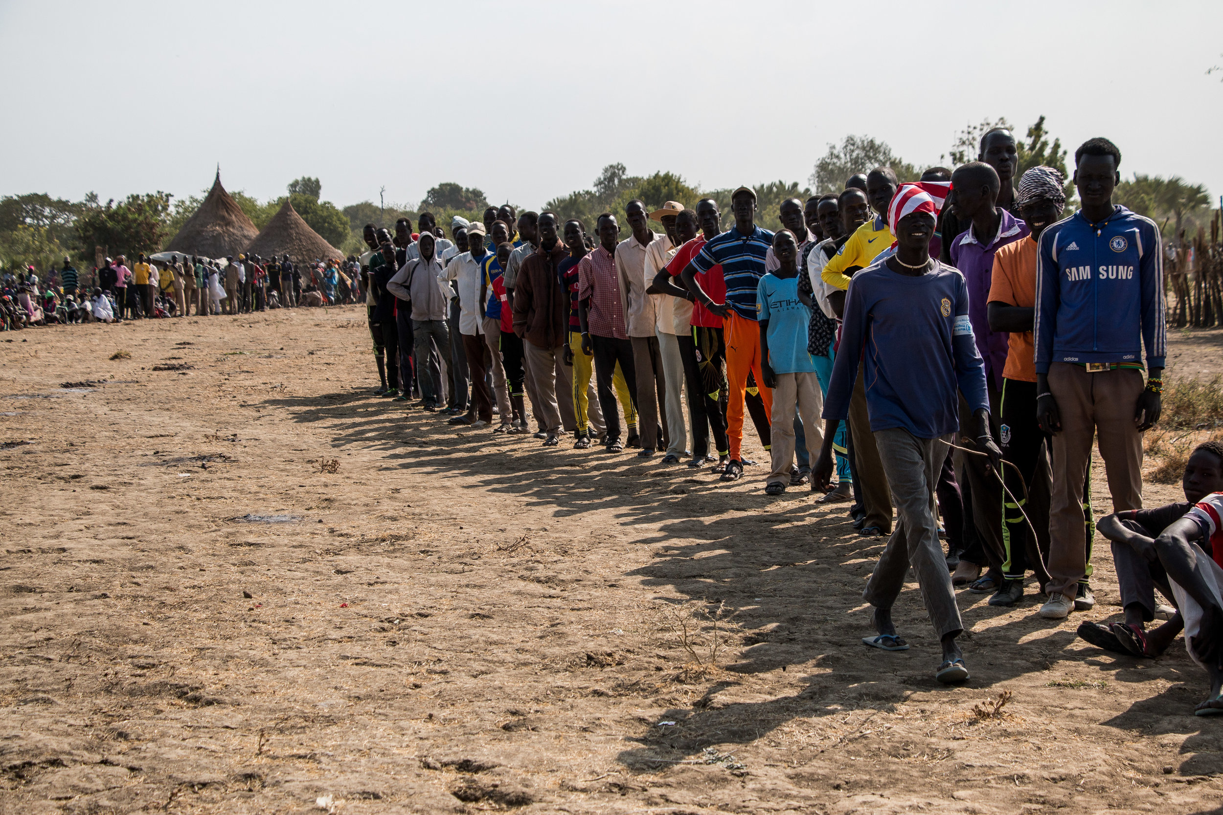 Men are separated from women and children during a food aid distribution in Unity state, South Sudan. Men are often separated during such operations because they are usually fitter, greedier and quick to quarrel. 