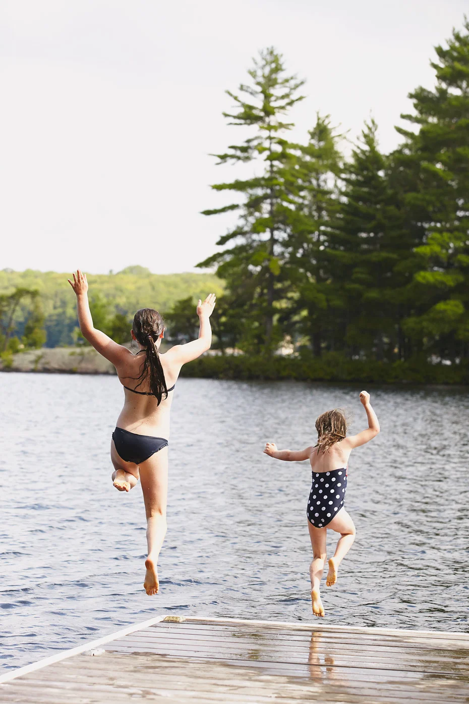 Stacey Van Berkel Photography I two young girls jumping off a dock I Muskoka, Ontario, Canada