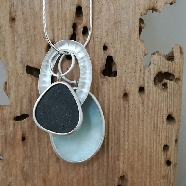 A pendant for the #artistssupportpledge today. Silver, enamel and Orkney pebble. The blueish grey enamel is on both sides of the enamelled component. Pendant is 40mm at longest. Available on a 16, 18 or 20'' snake chain. &pound;200 + &pound;7 p+p. DM