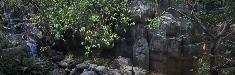 Statue by stream, Huntington Gardens, San Marino, California.