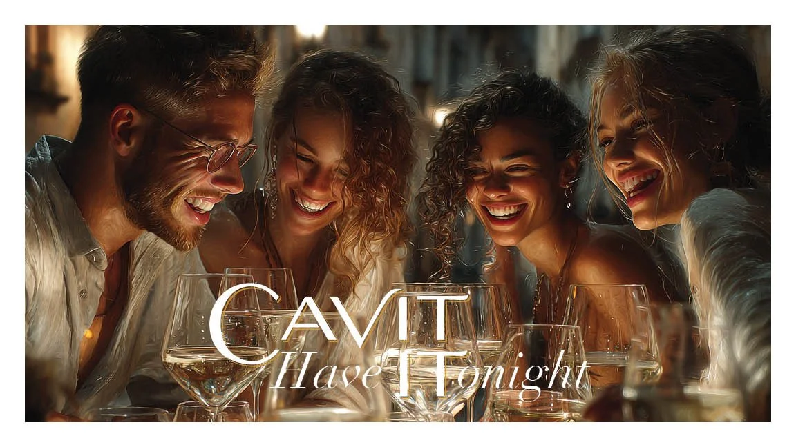 A group of five friends laughing and enjoying drinks together at a social gathering.