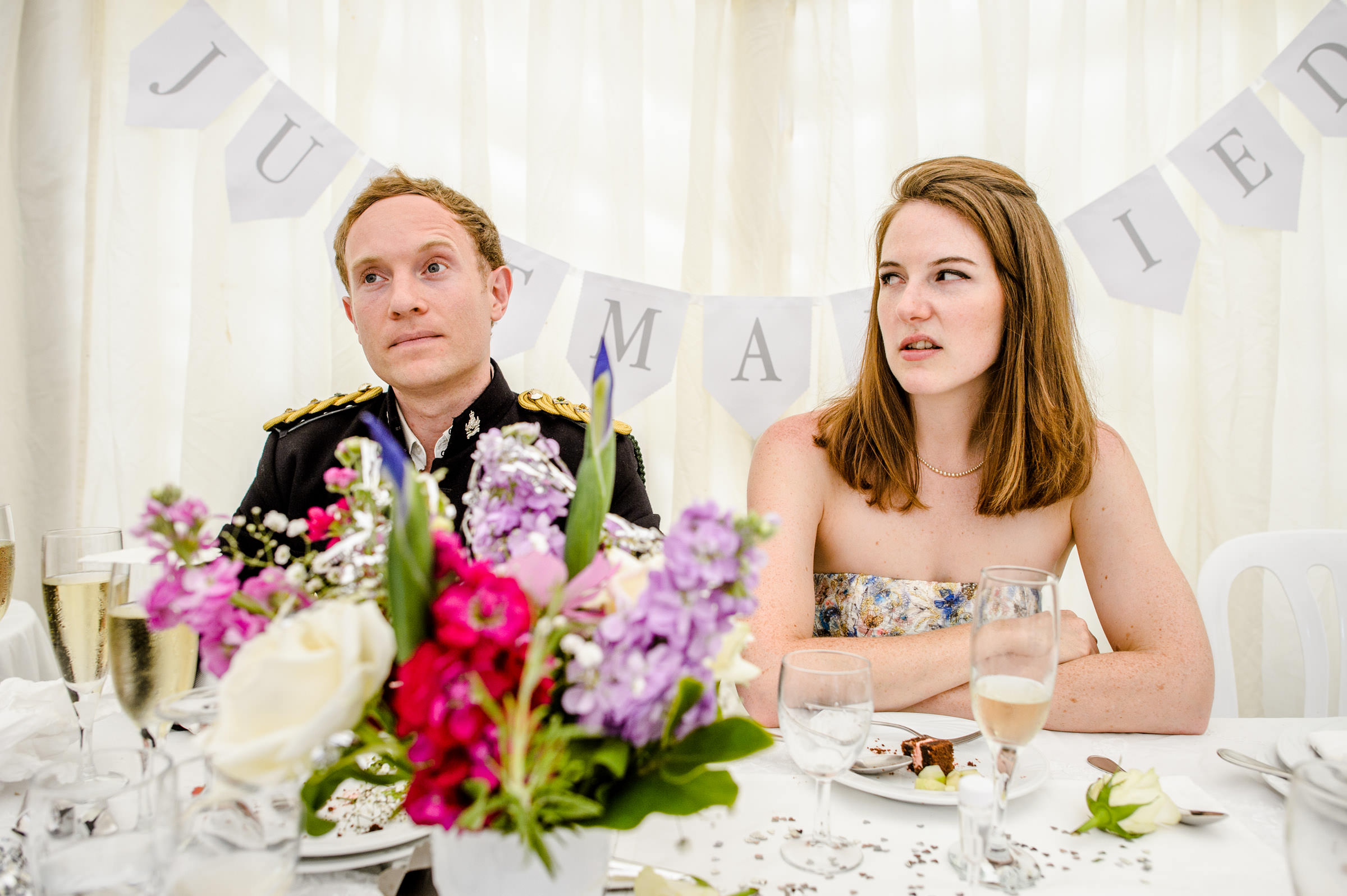 wedding photo of bride and groom during speeches.jpg