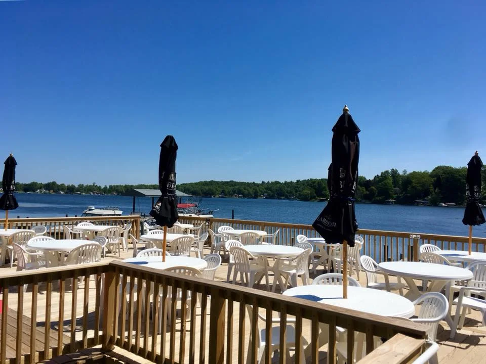 Bayfront deck with white tables.jpg