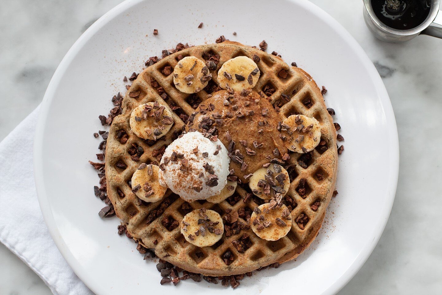 A sweet breakfast can be filling and energy giving, too!⁠
⁠
Our almond chocolate banana waffle is packed with plant protein. We hope you'll all come to give this one a try! 🥜🍫🍌