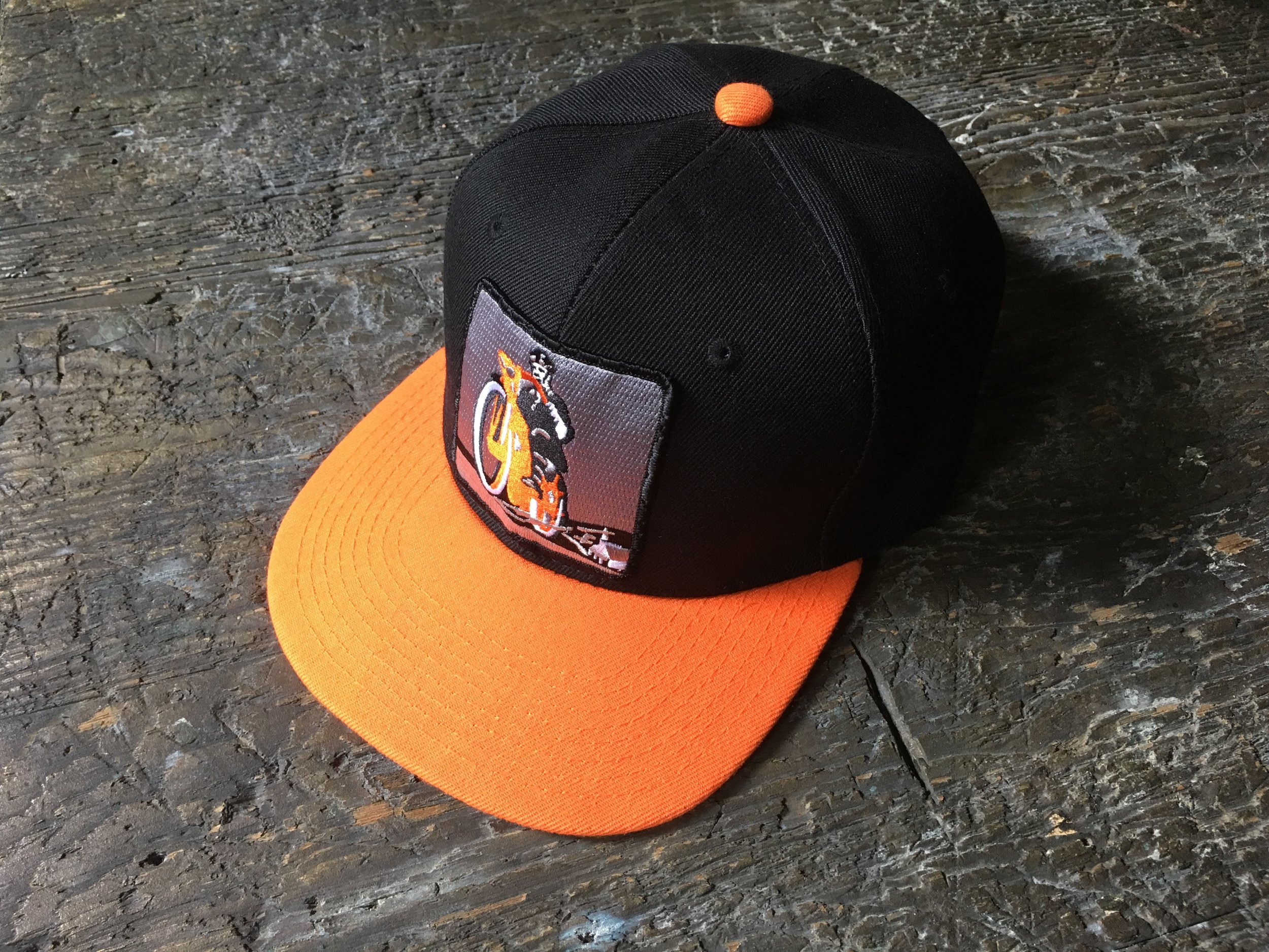 Black and Orange snapback hat w/ Flying Merkel rider patch