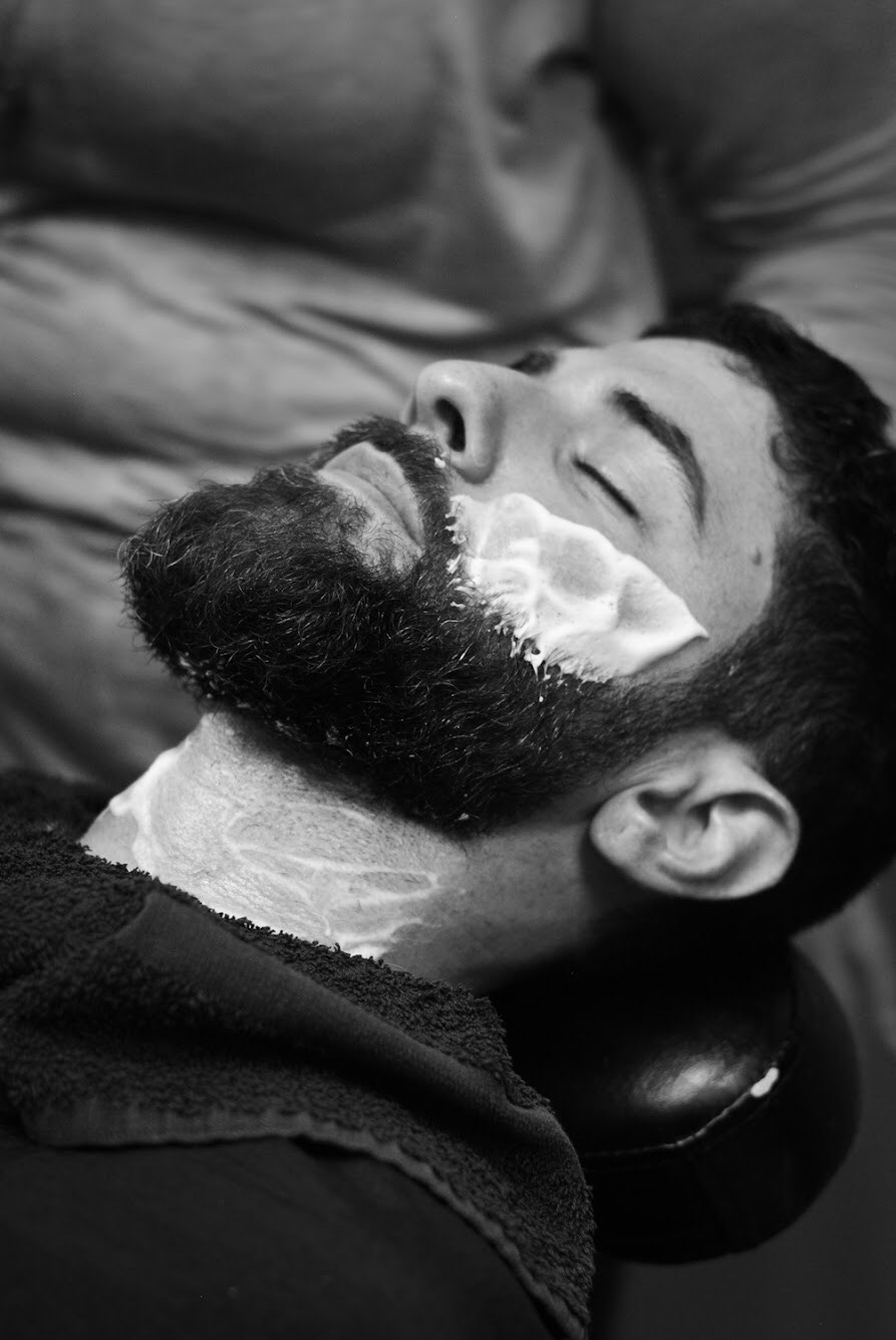 The Quinntessential Beard Trim includes a full shave of the cheeks and neck instead of us providing a straight razor outline of our basic service