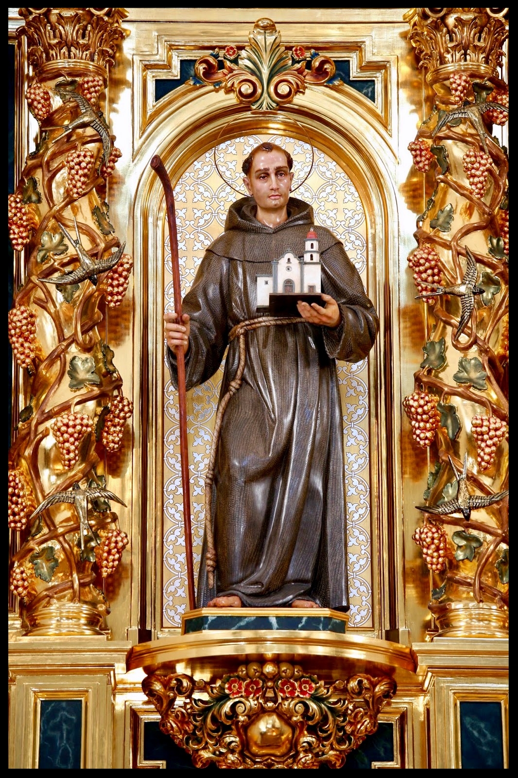 The statue of St. Junípero Serra in the Great Retablo of Mission Basilica San Juan Capistrano