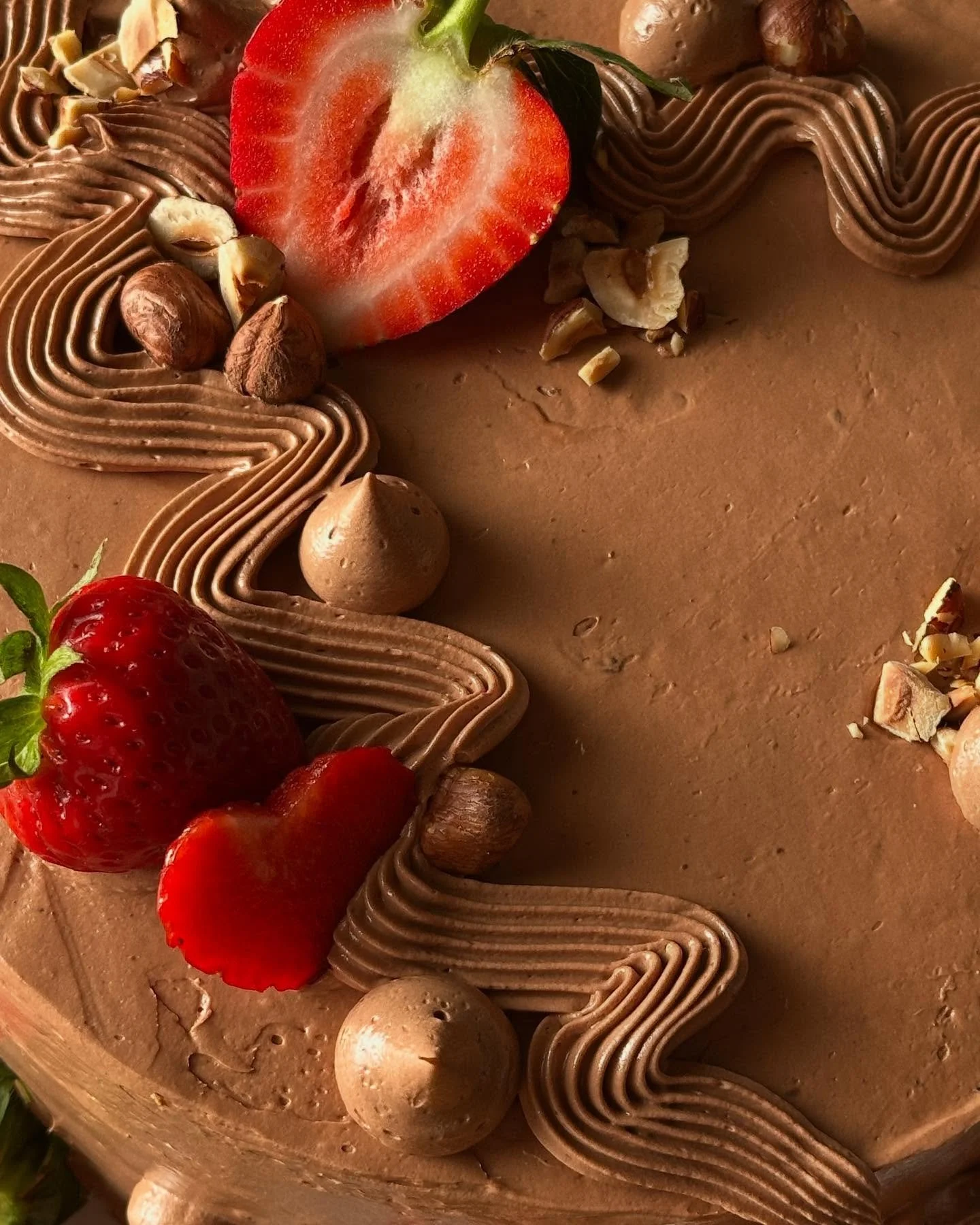 nm just thinking about the cake i made for @frannocean&rsquo;s bday a few weeks ago wbu? 🍓 chocolate cake with chocolate ganache, hazelnuts, strawberries, and chocolate buttercream 🫶