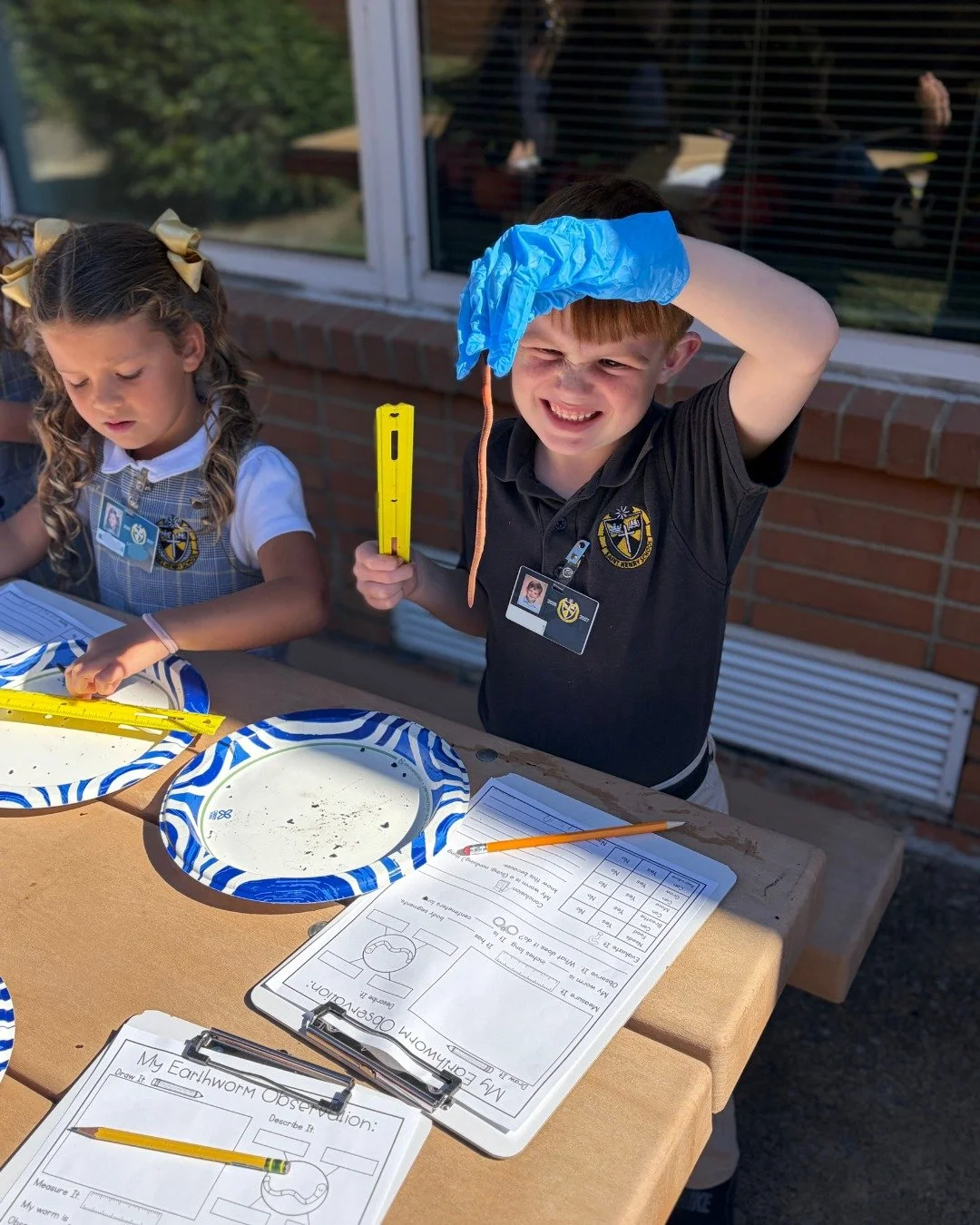What a beautiful day to observe some slimy, wiggly worms! 

Our First Graders have been learning all about living and non-living things! Monday, they observed gummy worms, and then yesterday, they got an up-close look at REAL worms! Through hands-on 