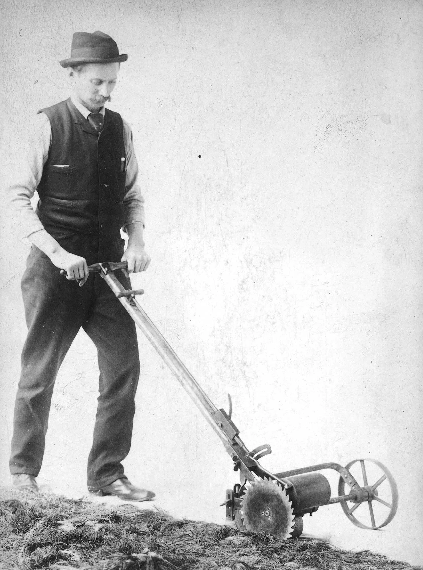 This portrait of Jensen edging the lawn shows the great pride he took in every aspect of his work. Ca. 1895, courtesy of the Johnson, Jensen, and Wheeler families.
